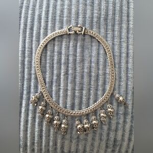 Chic Silver Choker Necklace with Ornate Charms.